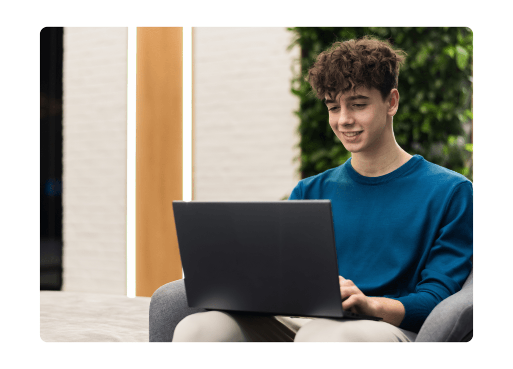 a learner listening to his tutor during an online lesson